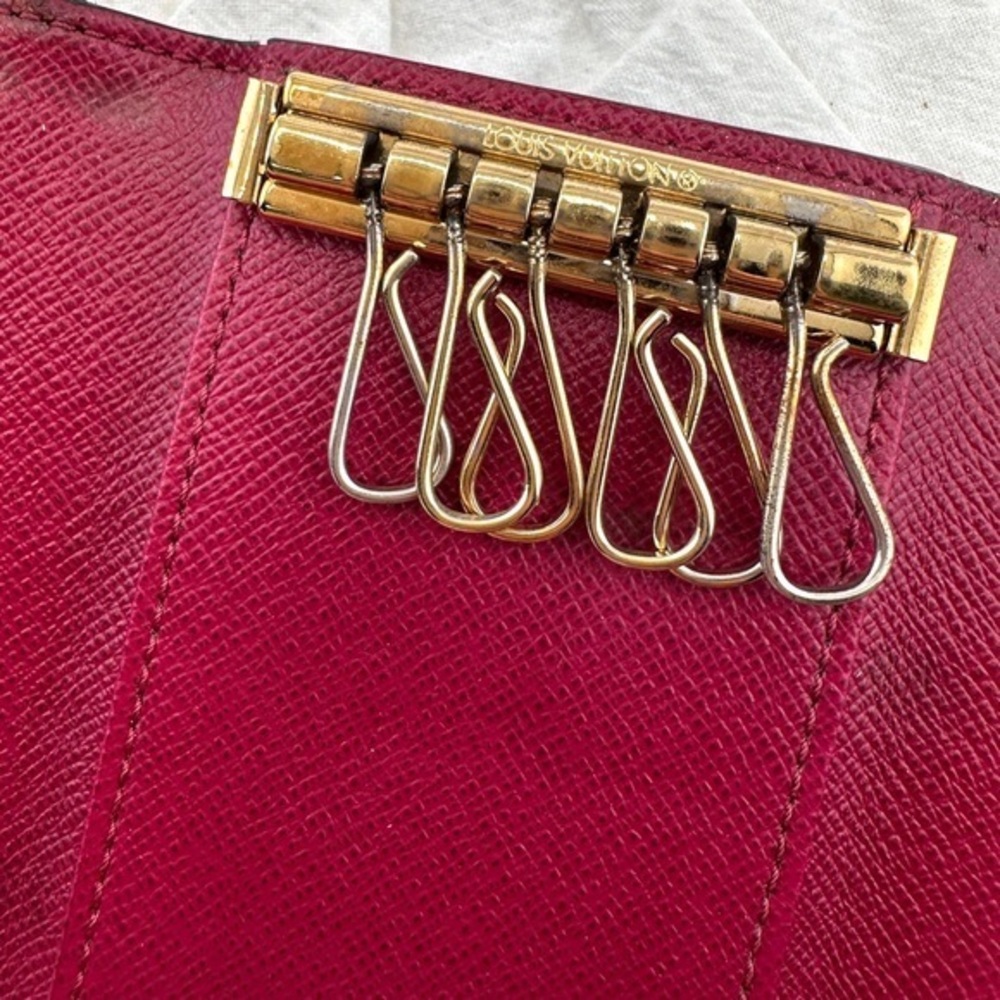 AUTHENTIC Louis Vuitton key holder. Monogram pattern. Magenta interior. - Picture 14 of 15